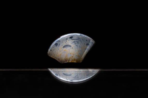 istock Reflection of a bubble in rainbow colors on a black background. 1134304869