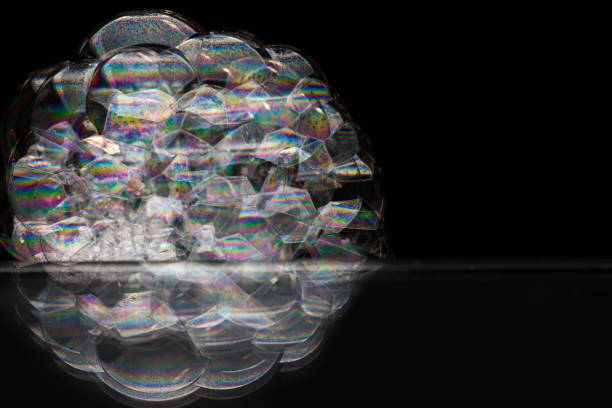 istock Reflection of a bubble in rainbow colors on a black background. 1134305623