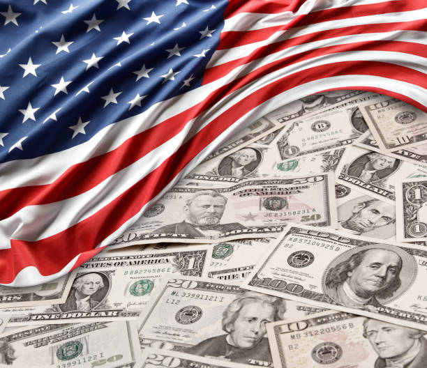 istock USA flag and cash 1134305904