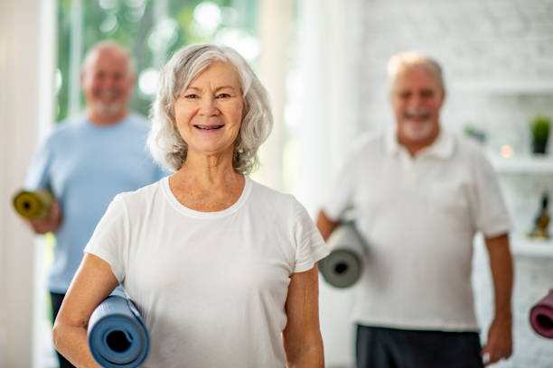 istock Seniors With Yoga Mats 1134306205
