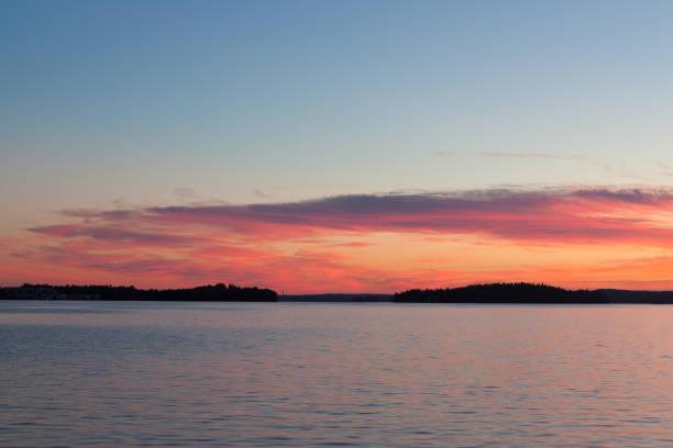 istock Calm sunset and clouds over lake 1134308668
