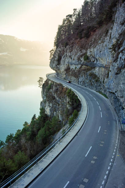 Beatenbay, along Lake Thun, Switzerland Beatenbucht, road along Lake Thun, Switzerland winding road mountain stock pictures, royalty-free photos & images