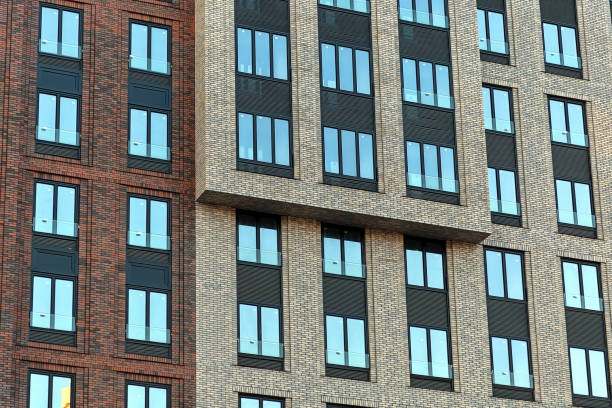 istock Colorful Brick wall of a skyscraper with windows. 1134310138
