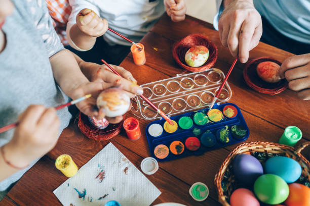 istock Family painting Easter eggs 1134311209