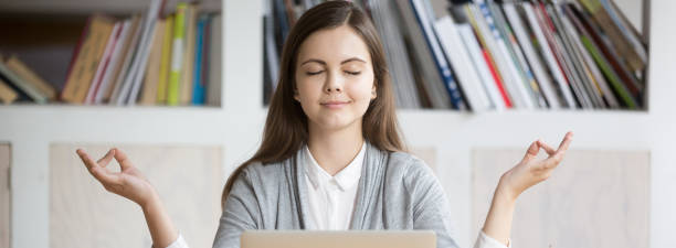 istock Horizontal photo woman relaxing meditating at workplace during working day 1134312121