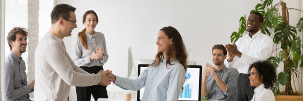 istock Boss handshaking with mixed race female employee congratulating with success 1134312244
