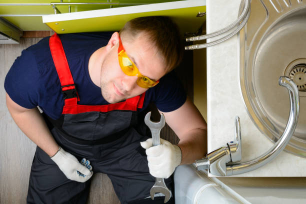istock Plumber in the kitchen repairing the water pipe: top view 1134313584