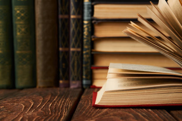 istock Stack of books on bookshelf, close-up. Education learning concep 1134317096