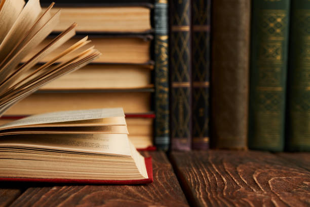 istock Stack of books on bookshelf, close-up. Education learning concep 1134317120
