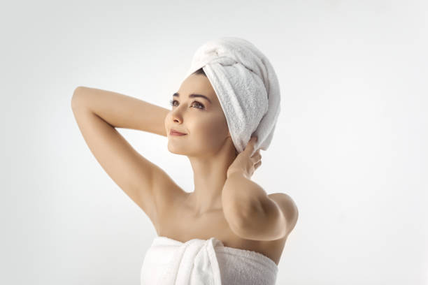 istock Beautiful young woman after bath on white background 1134318431