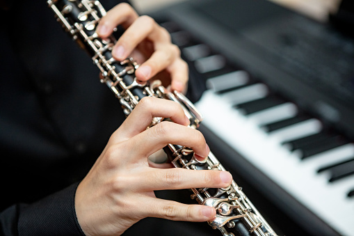Close-up of unrecognizable man playing clarinet
