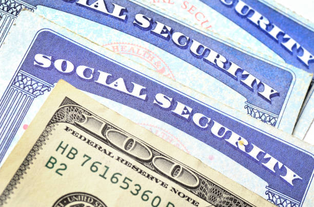 istock Social Security Cards and cash 1134323476