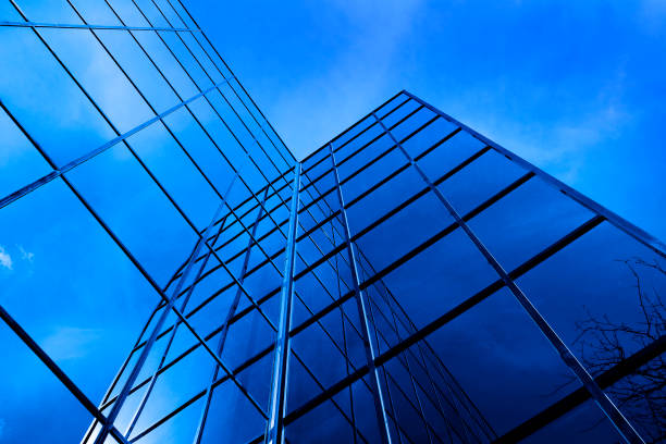 istock Business building with mirrored windows highrise financial with sky and clouds 1134323486