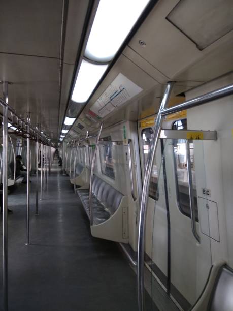 Delhi Metro Full of space, by chance. It's unusual. delhi metro stock pictures, royalty-free photos & images