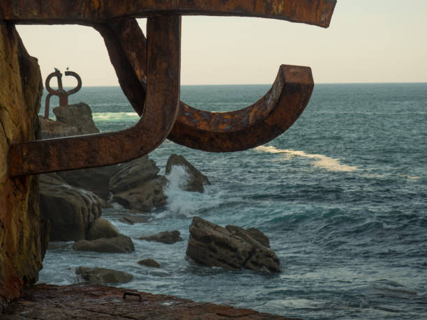 rusty iron sculpture in the sea