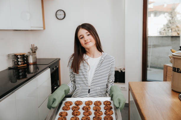 istock Young Girl Making Chocolate Chip Cookies 1134326791