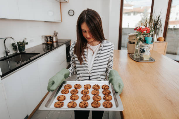 istock Young Girl Making Chocolate Chip Cookies 1134326793