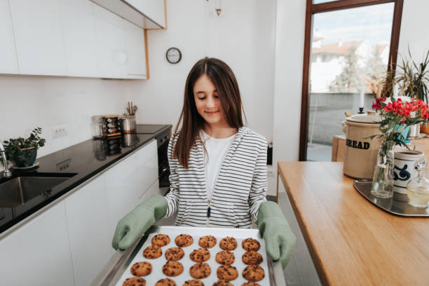 istock Young Girl Making Chocolate Chip Cookies 1134326794