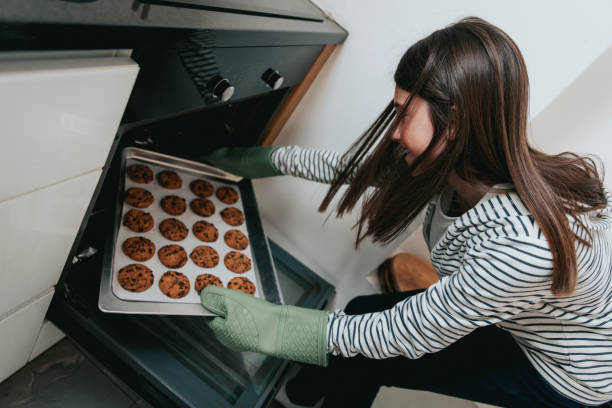 istock Young Girl Making Chocolate Chip Cookies 1134326795