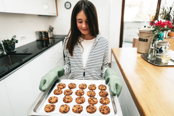 istock Young Girl Making Chocolate Chip Cookies 1134326802
