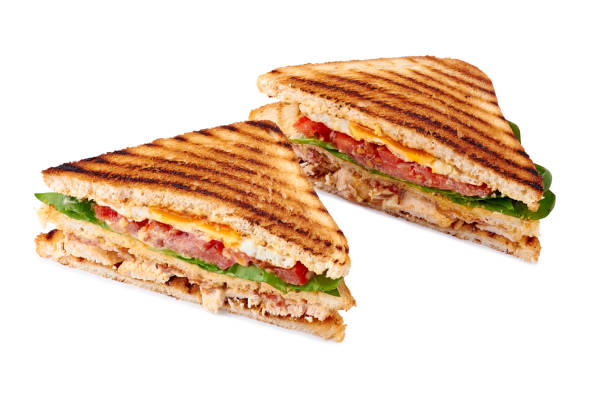 istock Juicy sliced club sandwich on white background 1134331224