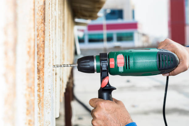 istock a professional mason is drilling into a concrete by his heavy duty drill machine 1134331250