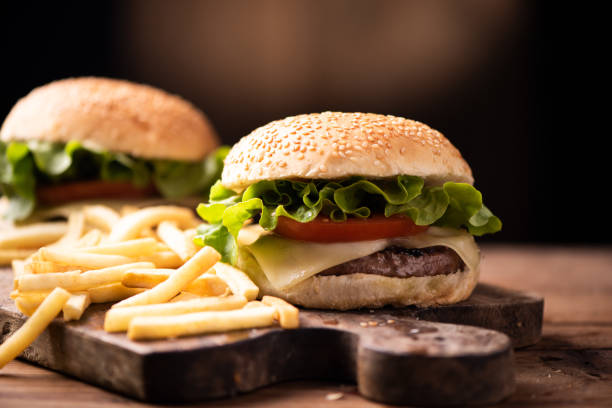 istock Homemade burger on wooden background. 1134331286