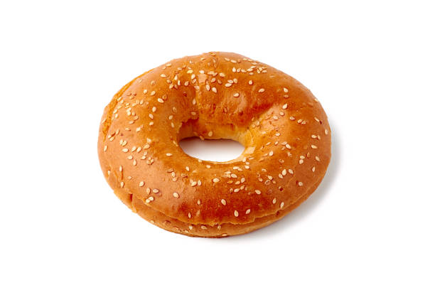 istock Fresh bagel with seeds on white background 1134331742