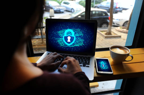 istock Woman's hands working on laptop data protection symbol on screen 1134333501