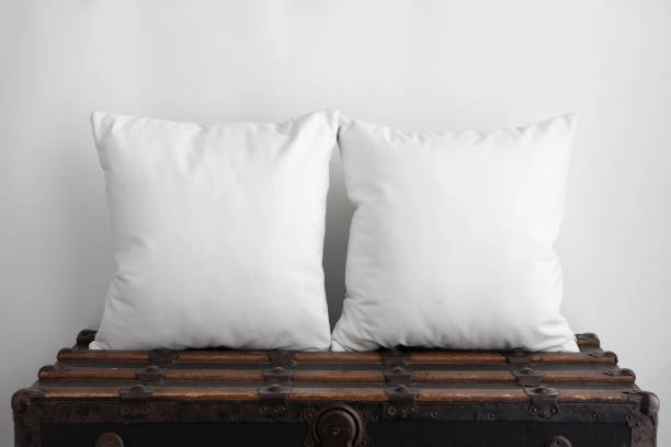 istock Two square white cushions on old vintage suitcase 1134334252