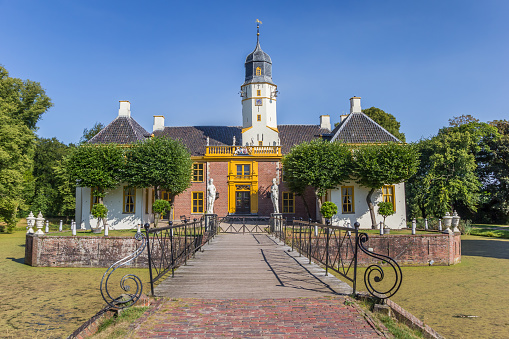 Slochteren, Netherlands - July 16, 2018: Bridge leading to the Fraeylemaborg mansion in Slochteren, Holland