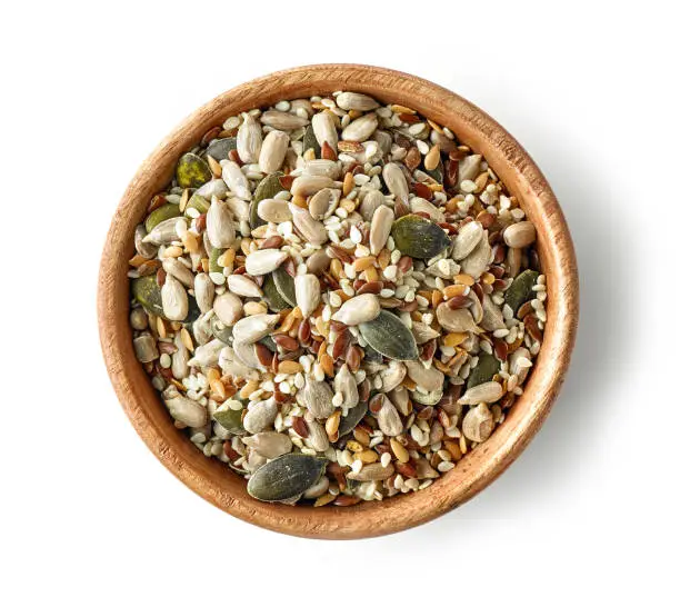Photo of mix of seeds in wooden bowl