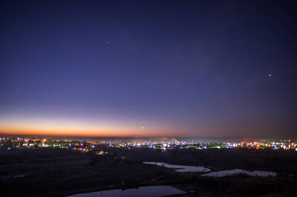 istock Sunrise and moon over the city 1134340754
