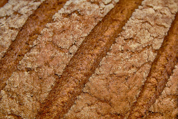 Freshly baked bread with a crust close-up. Backgrounds and Textures stock photo