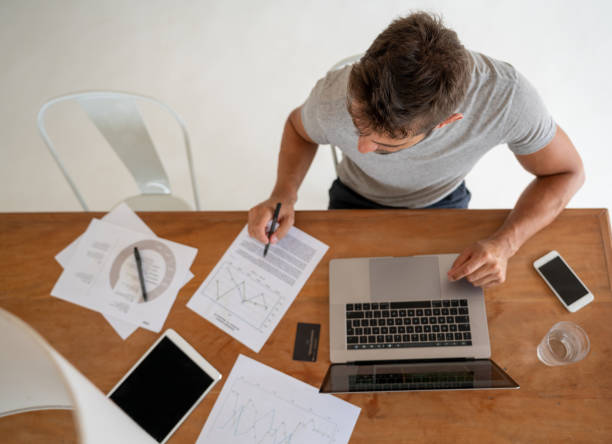 istock Man at home working online on his laptop computer 1134350112