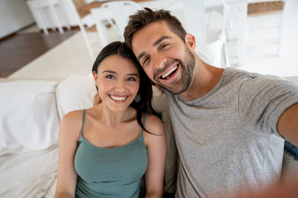 istock Happy loving couple at home taking a selfie 1134350131