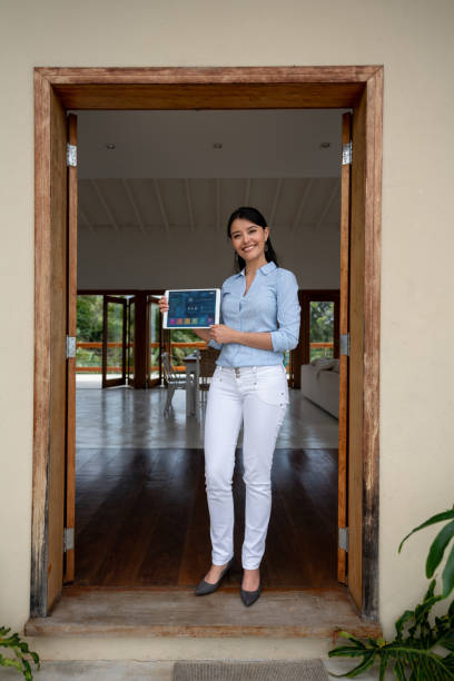 istock Real estate agent showing a intelligent home and holding a tablet computer 1134350145