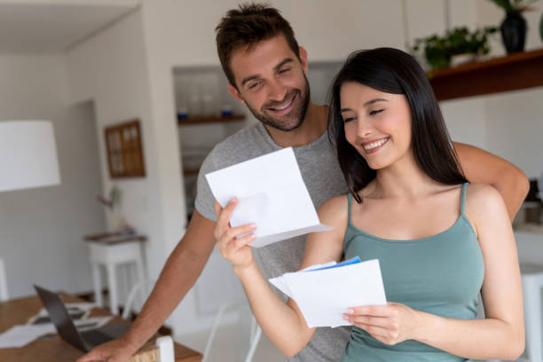 istock Loving couple at home checking the mail 1134350247