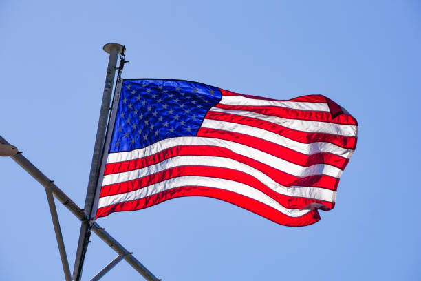 istock USA flag on a blue sky background 1134351206