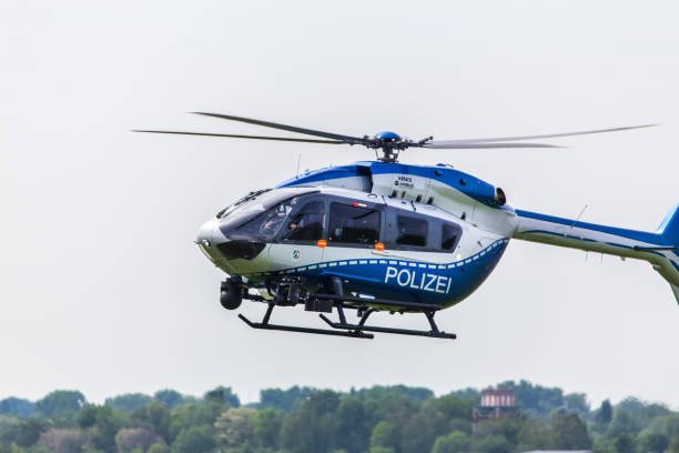 german police helicopter in the air at dusseldorf airport germany stock photo
