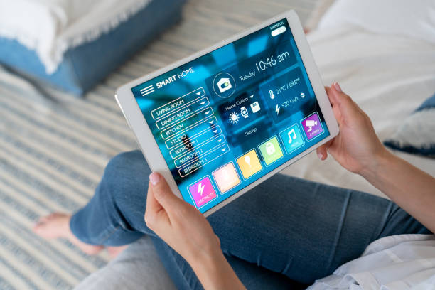 istock Close-up on a woman using a tablet computer to control her smart home 1134352254