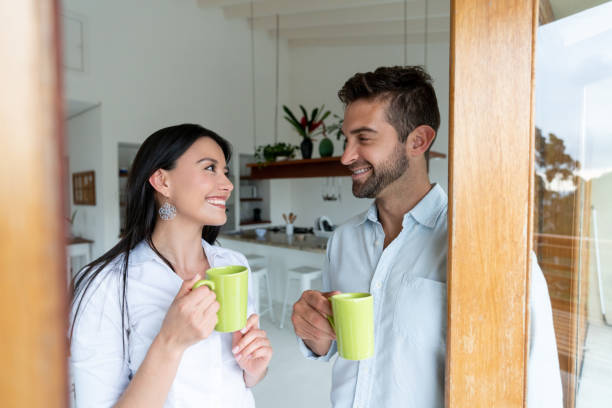 istock Couple at home drinking a cup of coffee and talking 1134352258