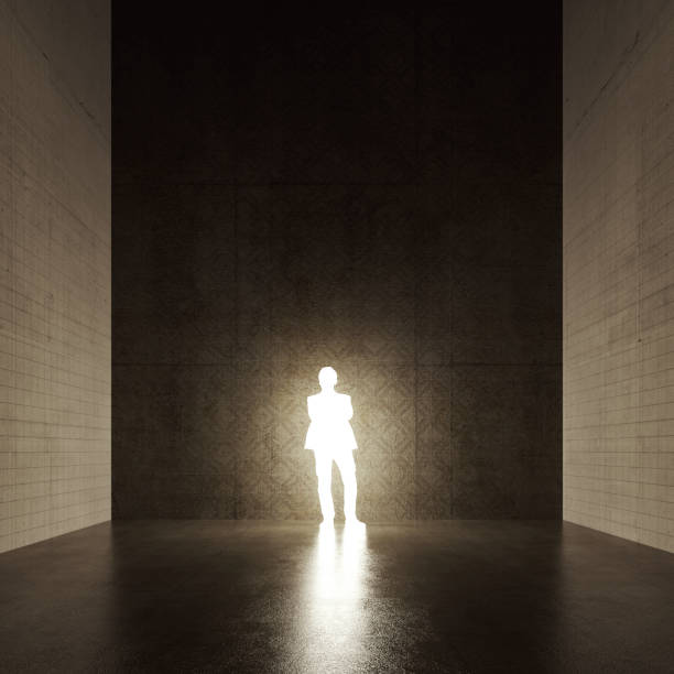 istock Glowing human silhouette in concrete room 1134352289
