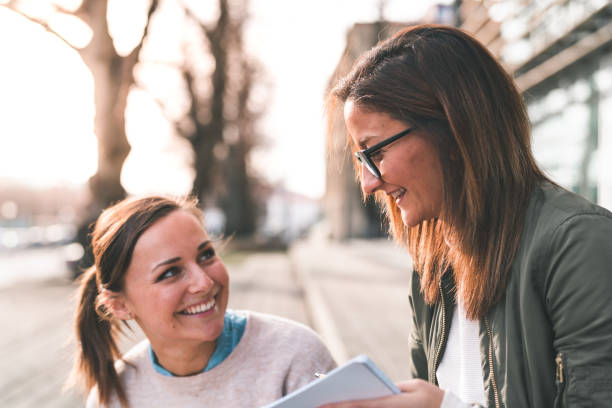 istock Two female students are working together on campus 1134353127