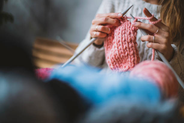 istock Close up on woman's hands knitting 1134361432