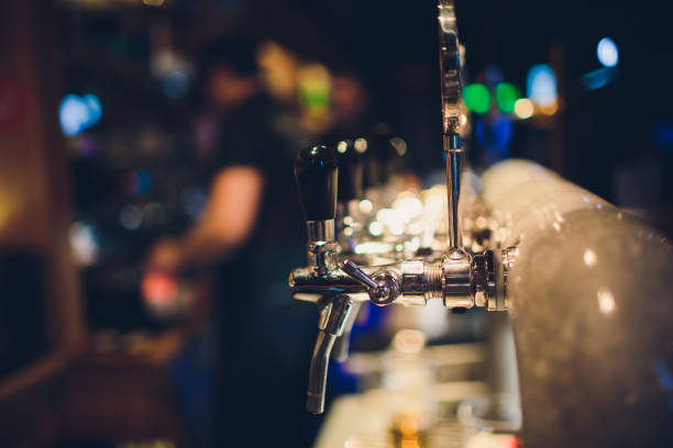 istock pouring a lager beer in a glass. 1134362090