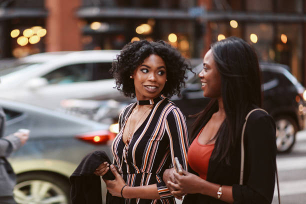 istock Two young female friends talking in downtown LA 1134362208