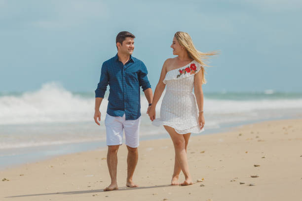 istock Passionate couple strolling on the beach 1134362714