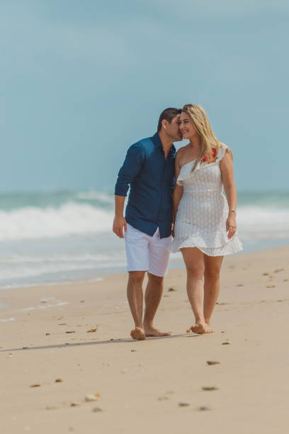 istock Passionate couple strolling on the beach 1134362756