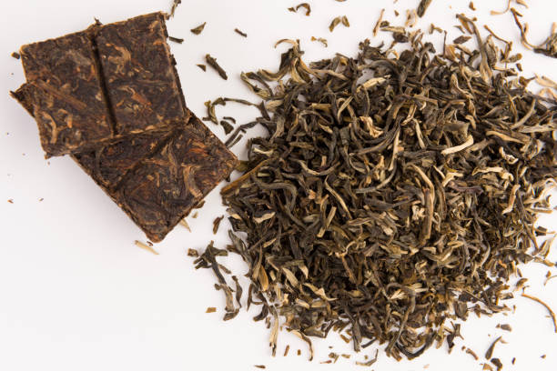 istock green tea isolated on white background, top view 1134362949